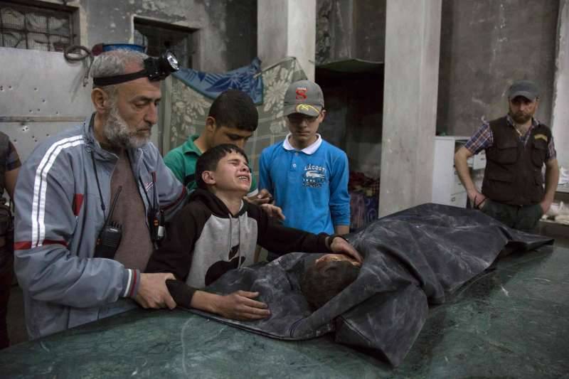 A Boy Next To The Body Of His Brother