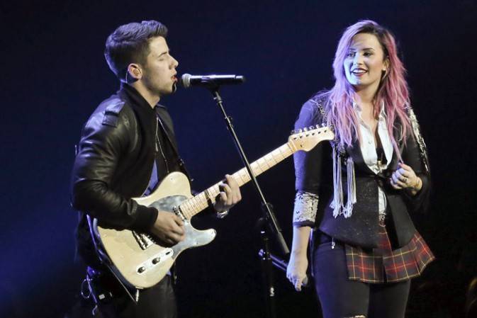 Nick Jonas and Demi Lovato Surprise Nightclub Employees at VIP Concert