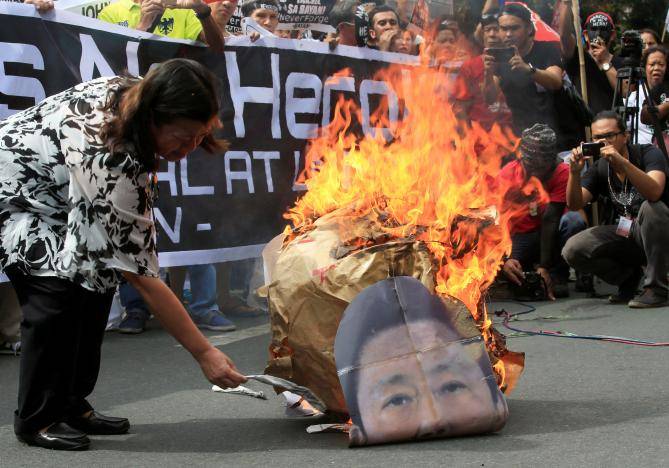 Philippine dictator Marcos buried with military honors at heroes’ cemetery