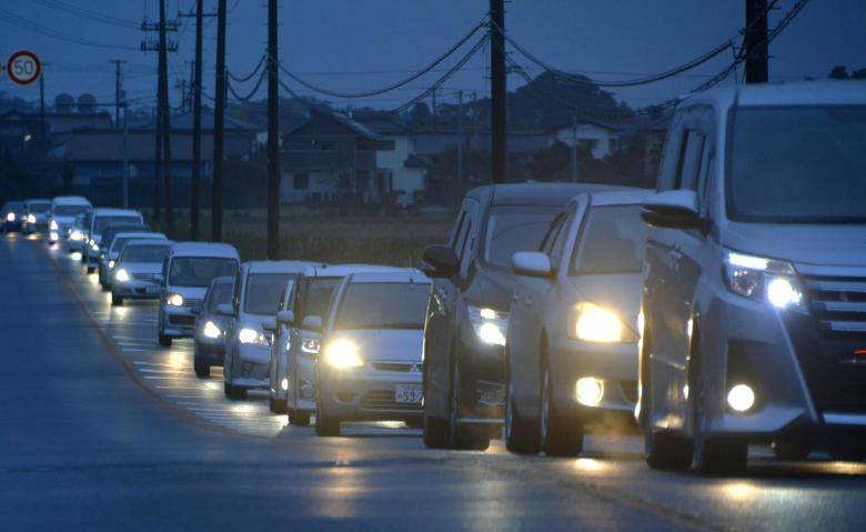 Tsunami hits Japan after strong earthquake, nuclear plant briefly disrupted