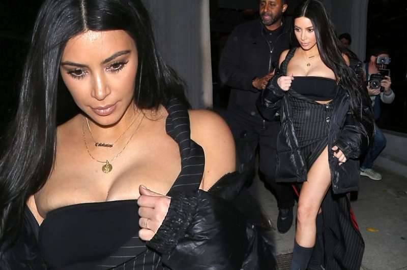 Kim Kardashian breaks boobs OR leg rule with unusual pinstriped dress for dinner in West Hollywood