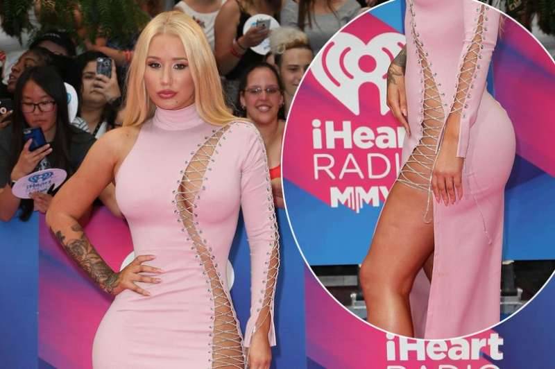 Iggy Azalea goes commando under eye-popping pink tie-up dress at iHeart Radio Much Music Video Awards