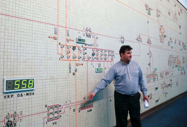 Dispatcher Shows Diagram Of Power Lines Inside Control Room Of Ukraine's National Power Company Ukrenergo In Kiev