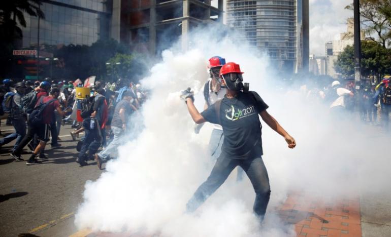 Venezuelan soldier shoots protester dead in airbase attack