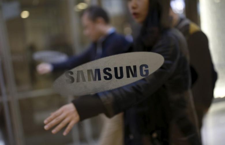 Employees Walk In The Main Office Building Of Samsung Electronics In Seoul