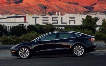 Tesla Musk hands over first Model 3 electric cars to early buyers