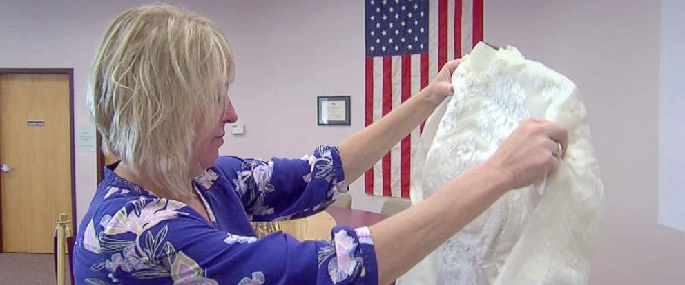 Woman reunited with her mother’s lost wedding dress found in attic