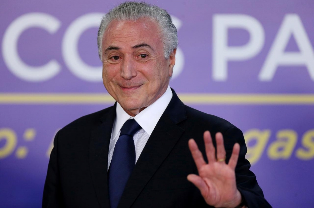 Brazil's president michel temer waves during a ceremony at the planalto palace in brasilia