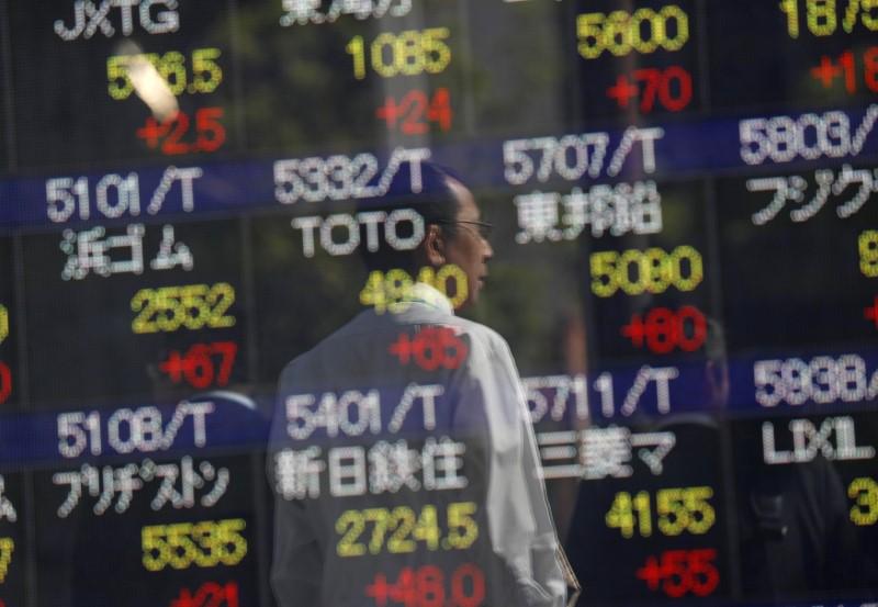 Japan shares at two-decade top, yen near three-month low as Abe wins