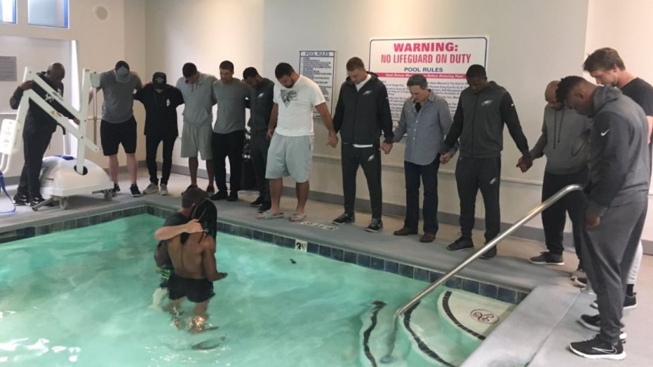 Philadelphia Eagles’ Marcus Johnson baptized in hotel pool with teammates by his side