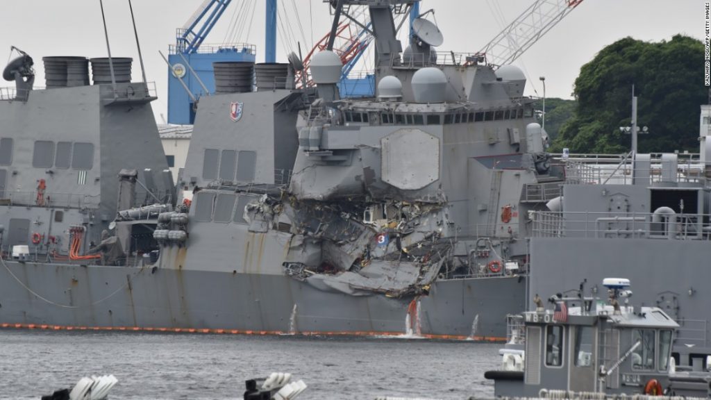 Crippled US destroyer damaged by transport ship