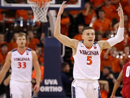 No. 15 Virginia clamps down on defense, tops Wisconsin, 49-37