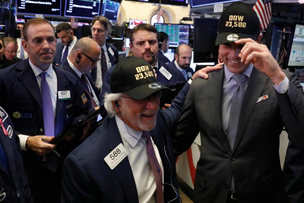 Wall St. edges higher after Fed holds steady on rates