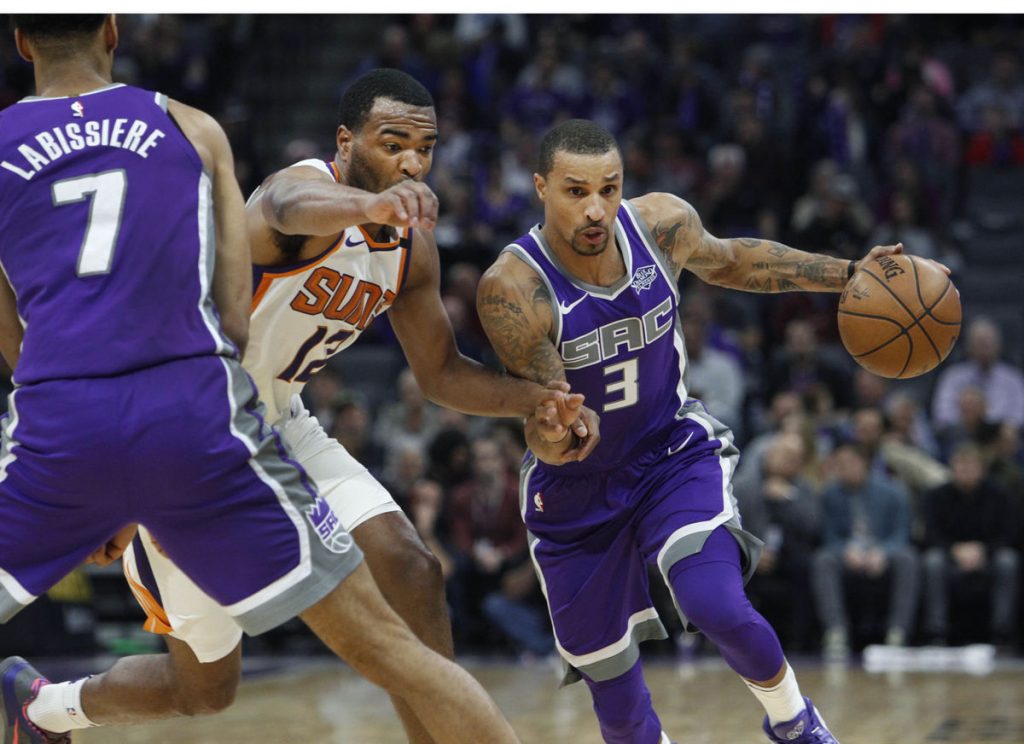 Booker overcomes tough night to rally Suns past Kings