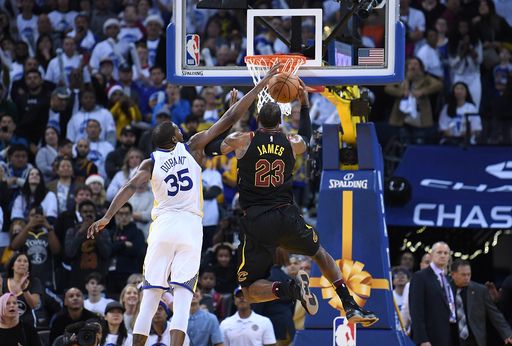 Durant delivers on both ends, Warriors beat Cavaliers 99-92