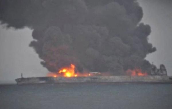 Rescue crews struggle to tame China oil tanker fire; crew still missing