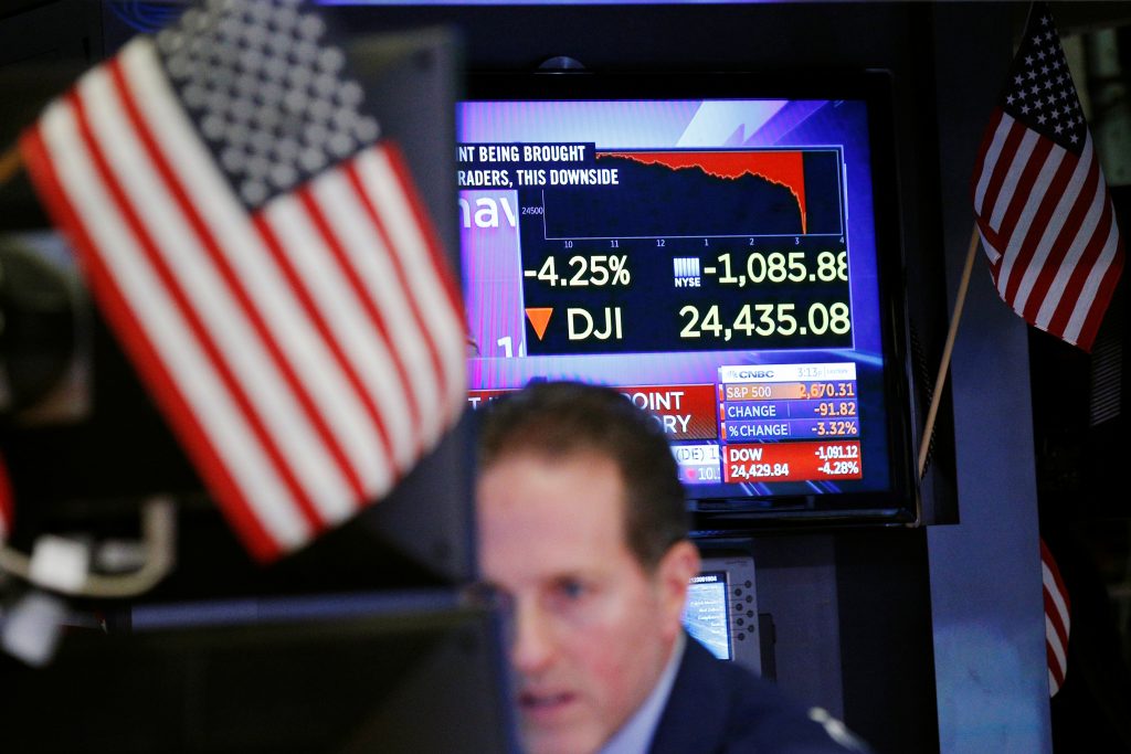 A television screen shows the days losses on the floor of the New York Stock Exchange in New York