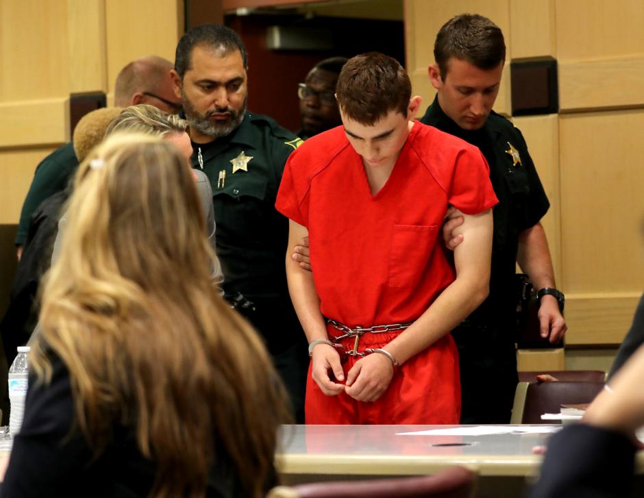 Head bowed, Florida shooting suspect returns to court for hearing