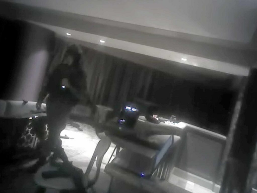 Body-camera footage captures tense moments as police officers charge Las Vegas gunman’s suite