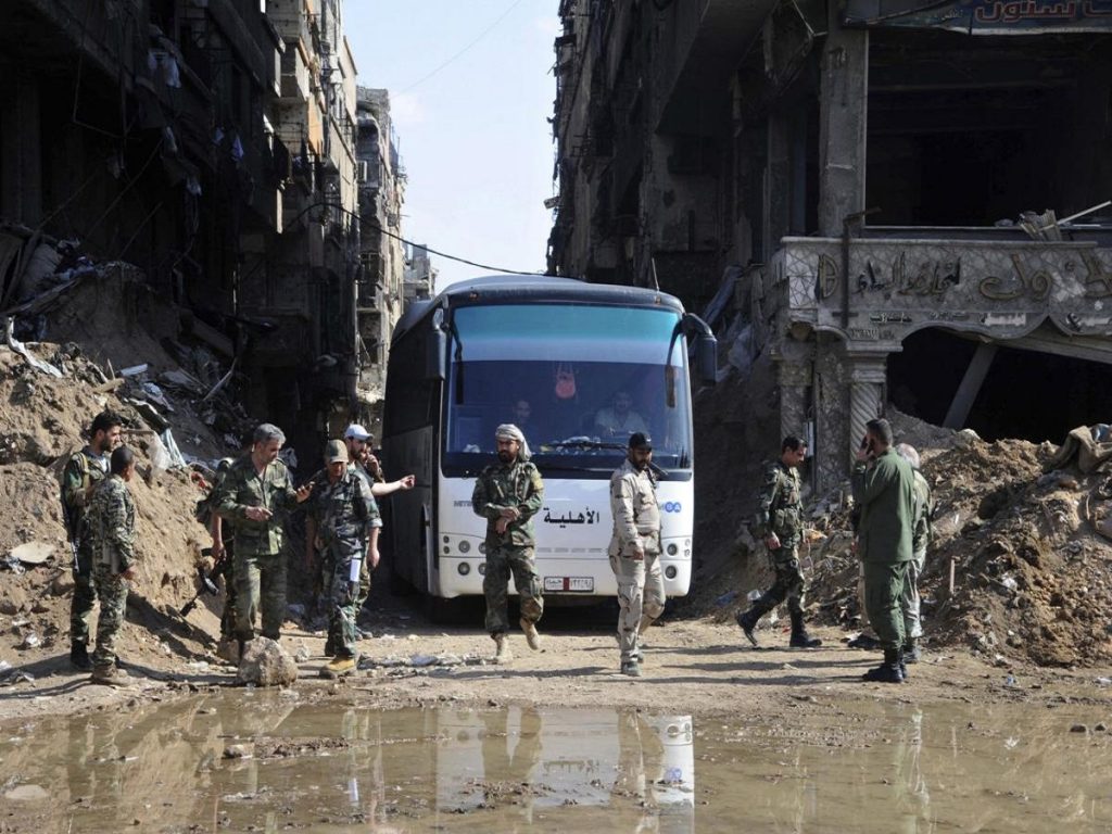 The Latest: Syrian rebels surrender north of Homs