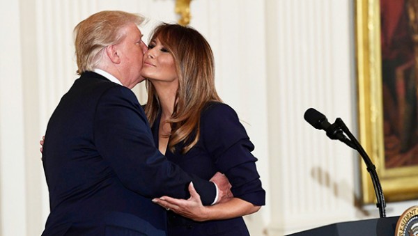 Donald & Melania Trump's Public Kiss Seemed 'Forced' — Body Language Expert Says