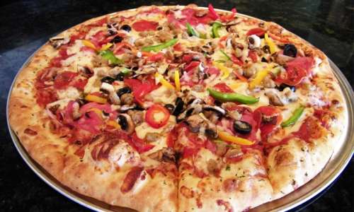 $16 for $30 Worth of Deep-Dish Pizza and Other Menu Items at Gino’s East